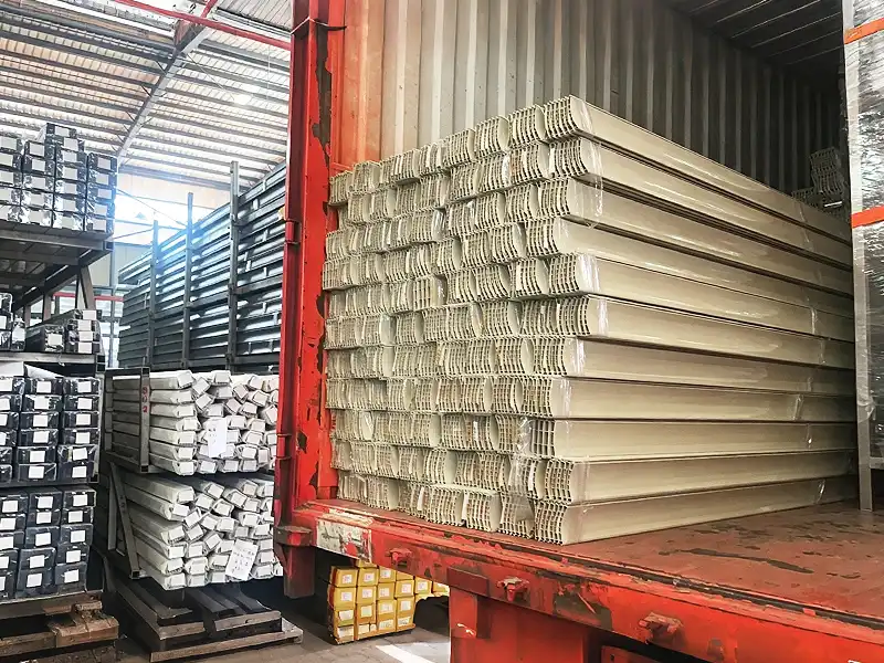 Container loading of custom aluminum roller shutter profiles at factory warehouse